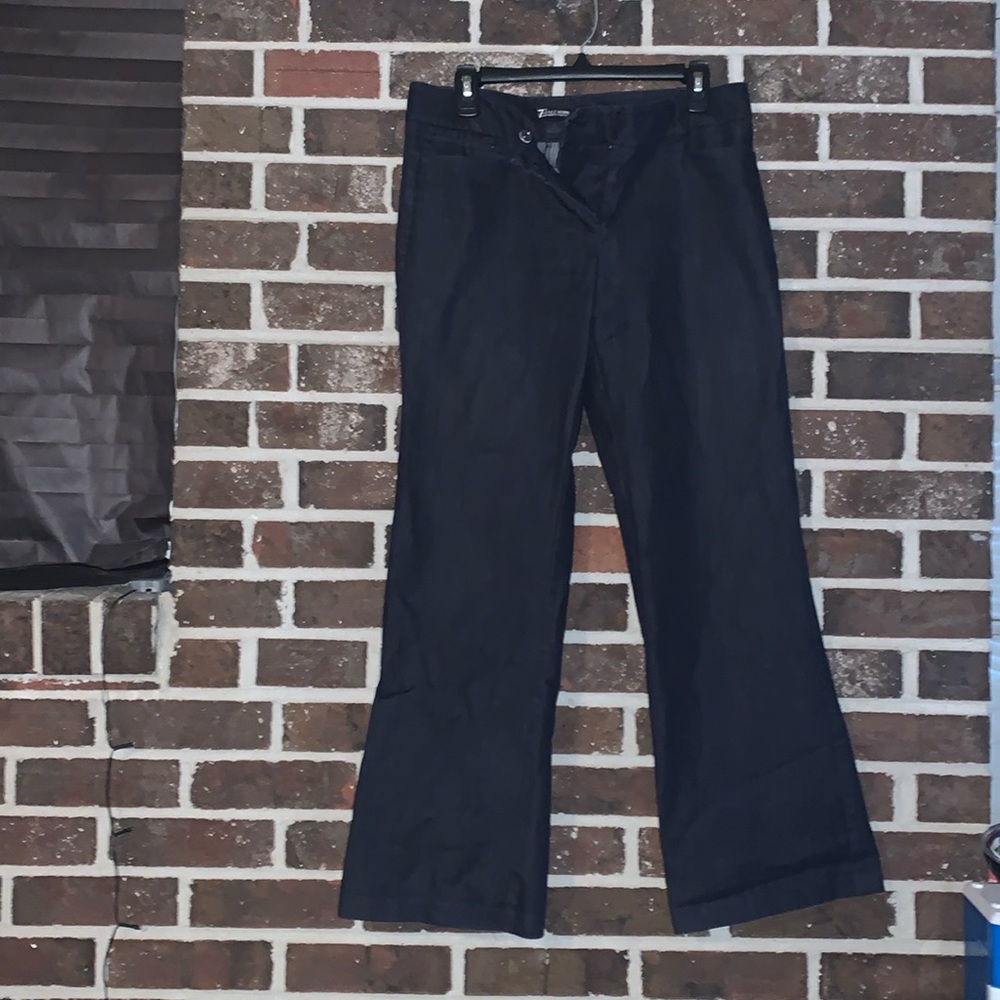 The size is a 8 in women’s and the dress pants are navy blue